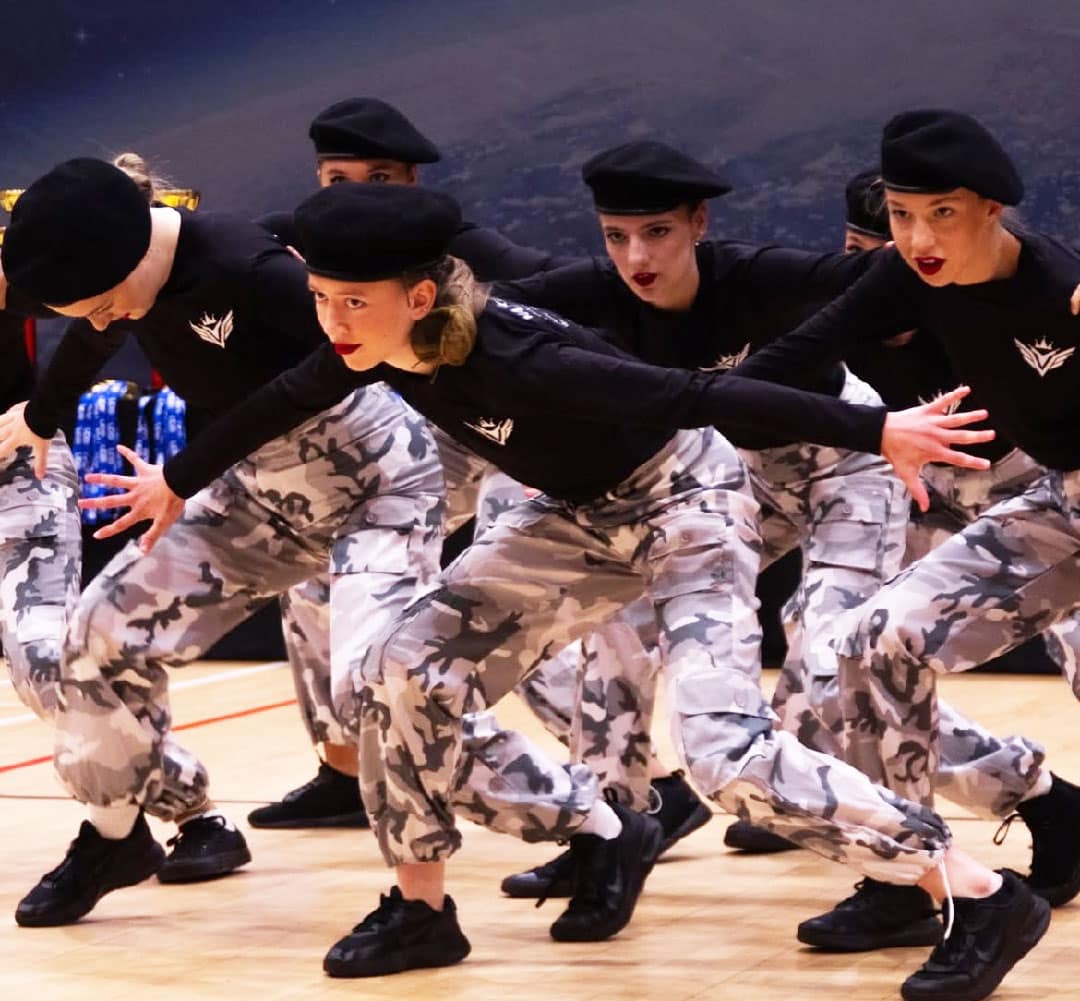 dance group in camo
